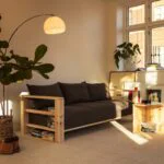 Tapicerowana nowoczesna sofa BARE z funkcją spania